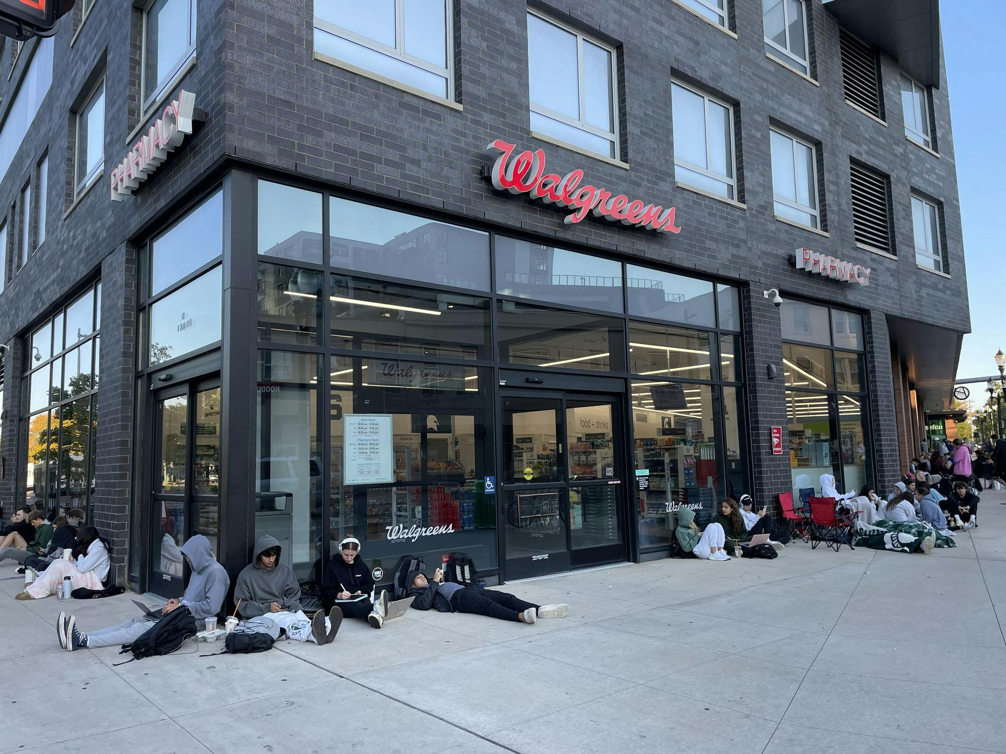 Dozens of MSU students line up along Abbot Road to secure their apartment at The Abbot at 9 a.m. on Monday, Oct. 2, 2023, the day that leasing opens at the complex. 