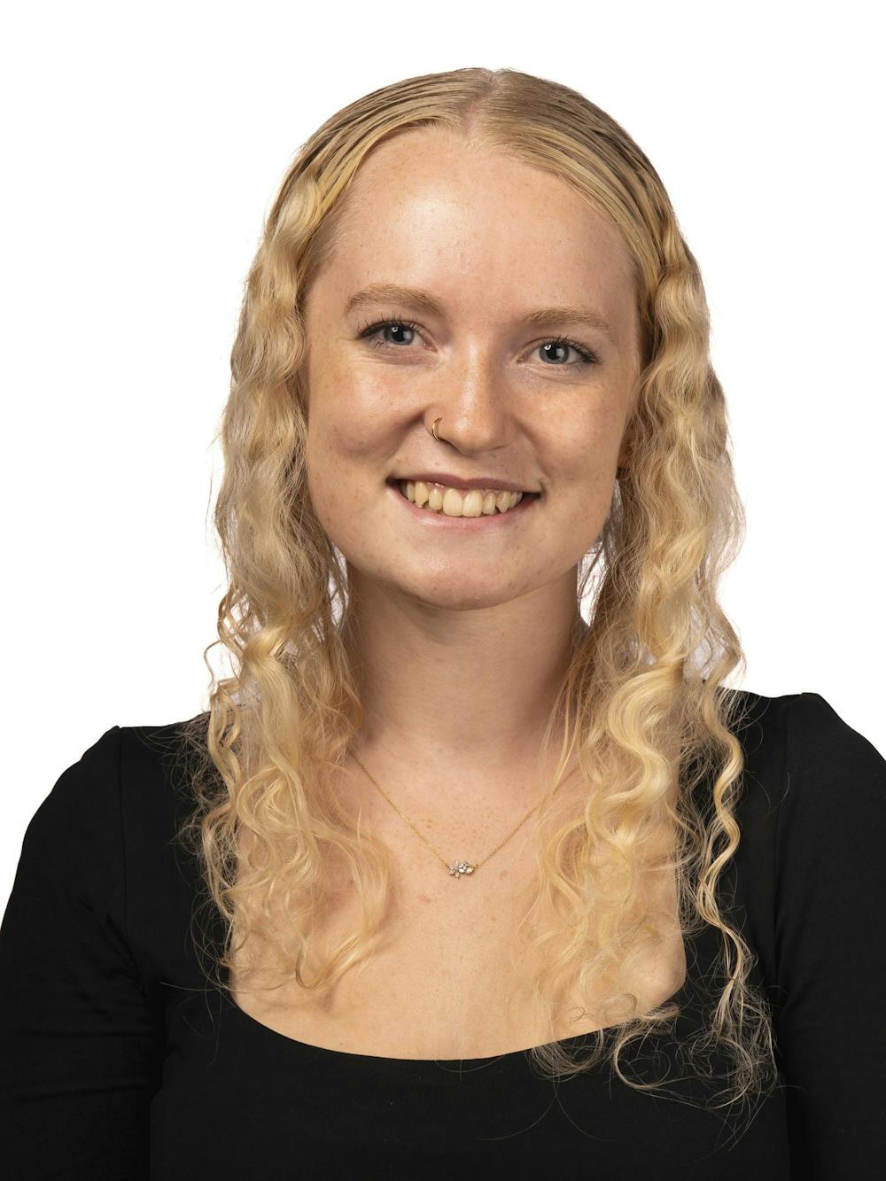 A staff member poses for a headshot at The State News office on Thursday, Sept. 3, 2026, in East Lansing, Michigan.