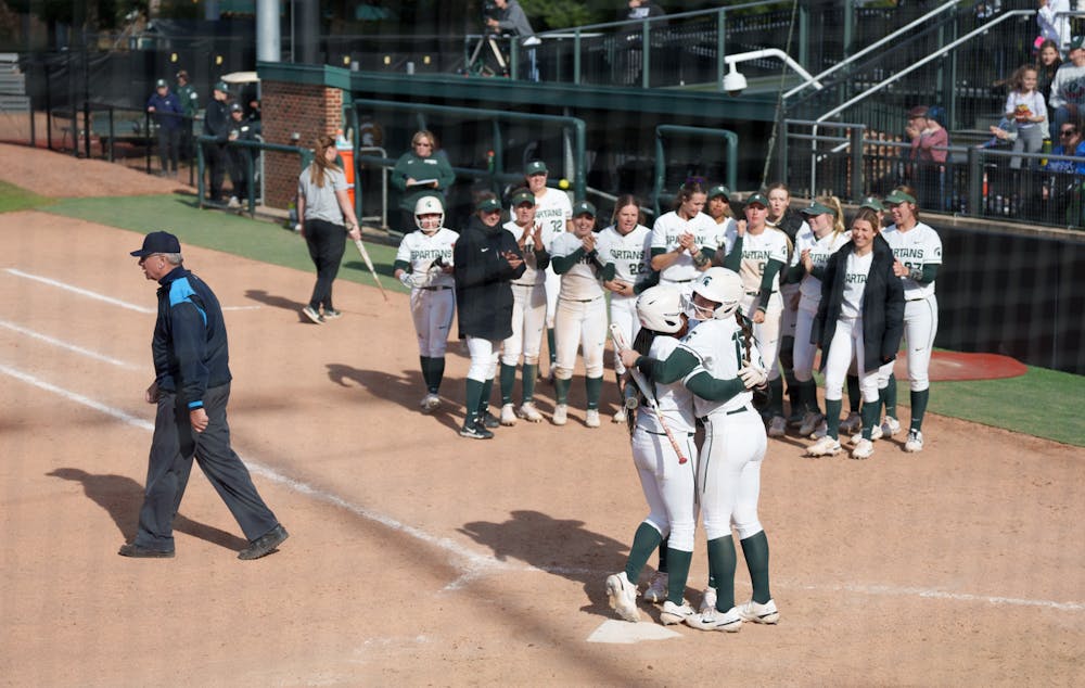 <p>Michigan State sophomore Zaquai Dumas running to her team waiting for her, as she scores the second home run of the game. Spartans lost 5-4 against Nebraska, on April 10, 2022.</p>