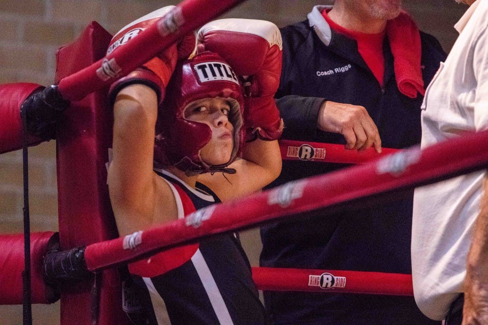 Brett Bray is checked by the referee before his fight in the 70 lb Bantam Novice Division at the Capital City Fight Night at the RA1 Basketball Range Nov. 2, 2018. Bray fought for Joe's Boxing ALCC.