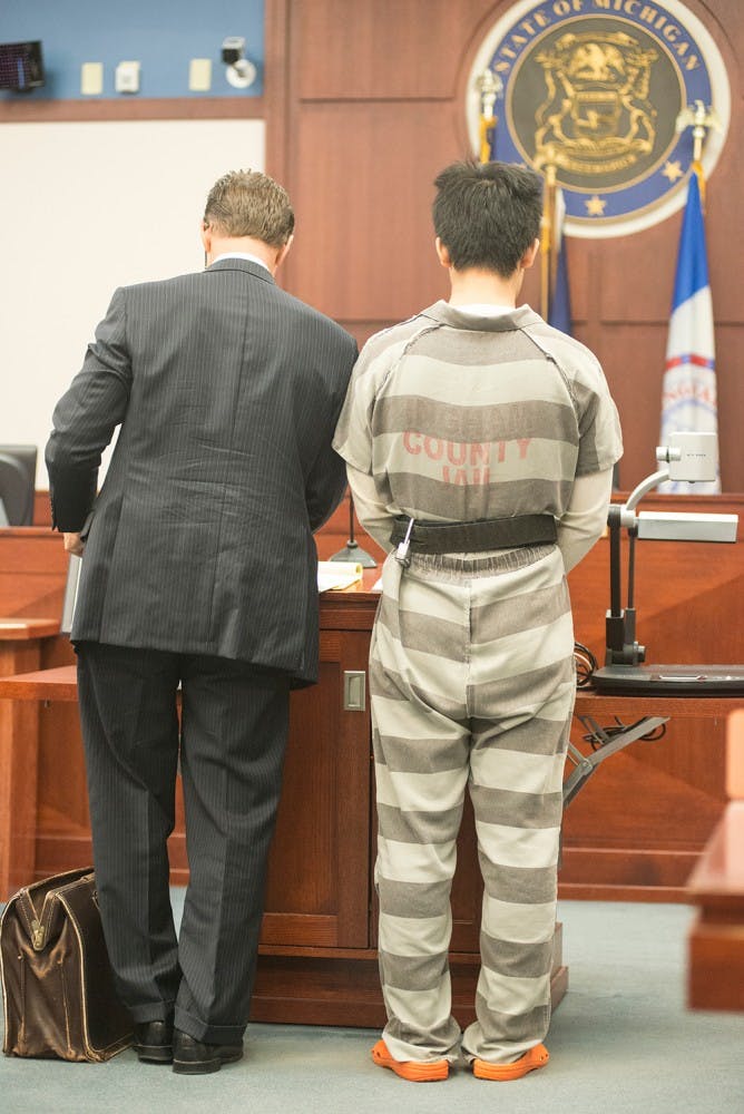 <p>Meng Long Li, 25, a China native and MSU alumnus  stands for his sentence for assault with a dangerous weapon. During a celebration of the 2014 Chinese New Year, he beat fellow MSU student, Yan Li, with a water pitcher.  Catherine Ferland/ The State News</p>