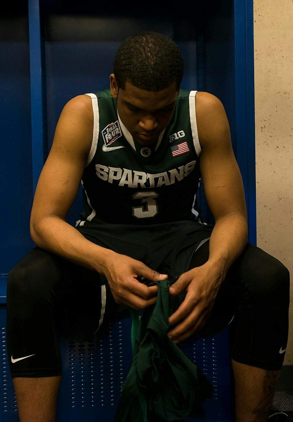 <p>Sophomore guard Alvin Ellis III sits in his locker April 4, 2015, after the semi-final game of the NCAA Tournament in the Final Four round at Lucas Oil Stadium in Indianapolis, Indiana. The Spartans were defeated by the Blue Devils, 81-61. Erin Hampton/The State News</p>