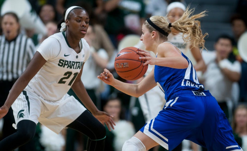 <p>Freshman guard/forward Jasmine Lumpkin guards Grand Valley guard Taylor Lutz during the game on Nov. 9, 2014, at Breslin Center. The Spartans defeat the Lakers 70-51. Raymond Williams/The State News</p>