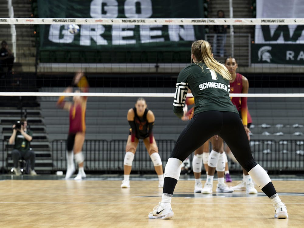Lia Schneider (1), MSU junior defensive specialist/libero, prepares to receive the serve during the volleyball match against USC at the Breslin Center on Wednesday, Nov. 26, 2025.