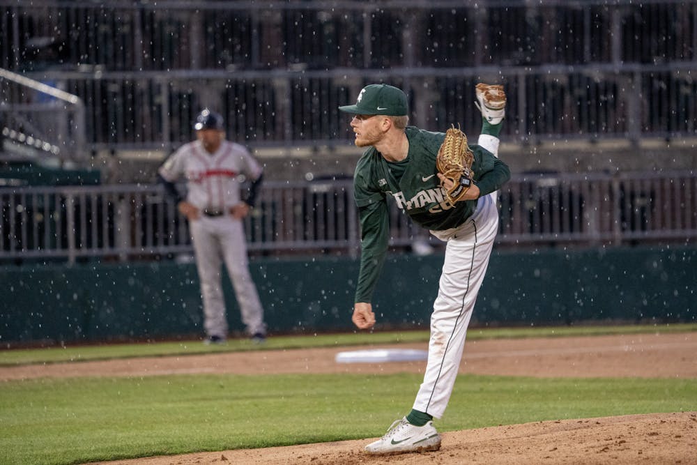 <p>MSU sophomore pitcher Dominic Pianto plays through the rain at the Crosstown Showdown against the Lansing Lugnuts on April 4, 2023.</p>