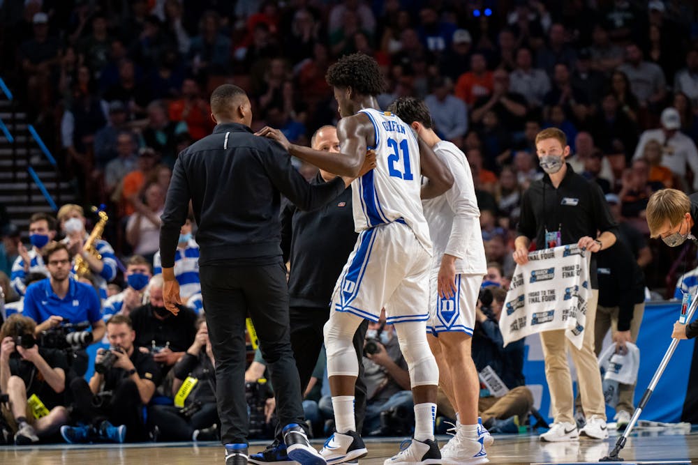 <p>Freshman forward AJ Griffin is assisted off of the court during Duke&#x27;s victory over Michigan State on March 20, 2022.</p>