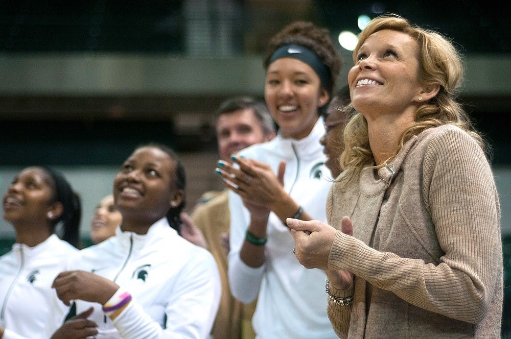	<p>Head coach Suzy Merchant smiles after being honored by Eastern Michigan on Thursday, Nov. 15, 2012, at the Convocation Center in Ypsilanti, Mich. Merchant previously coached Eastern Michigan for nine seasons. Julia Nagy/The State News</p>