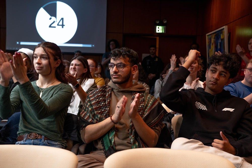 MSU students react to a student's speech during a MSU Board of Trustee's meeting in East Lansing, Mich., Feb. 2, 2024. The Board of Trustees fielded comments from the public, including the divestment of the university's assets from Israel.
