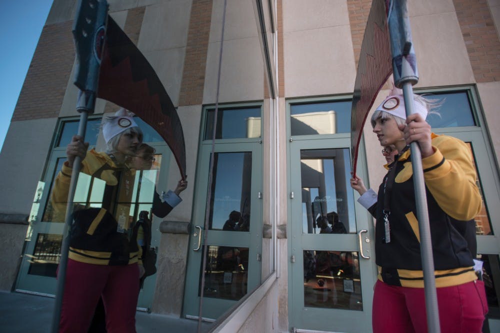 Olivet resident Dezzi Cotton poses in front of a mirror on March 20, 2016 at Shuto Con in the Lansing Center at 333 East Michigan Ave., Lansing. Shuto Con is Lansing's annual anime convention that focuses on artists and the art of interactive cosplaying.