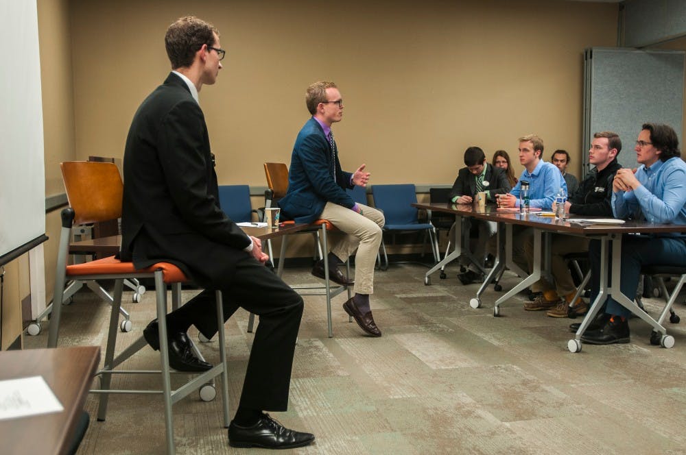 Political theory and constitutional democracy and international relations sophomore Lorenzo Santavicca, left, political theory and constitutional democracy junior Bryn Williams, right, debate for ASMSU office of the President on April 13, 2016 at Student Services Building. 