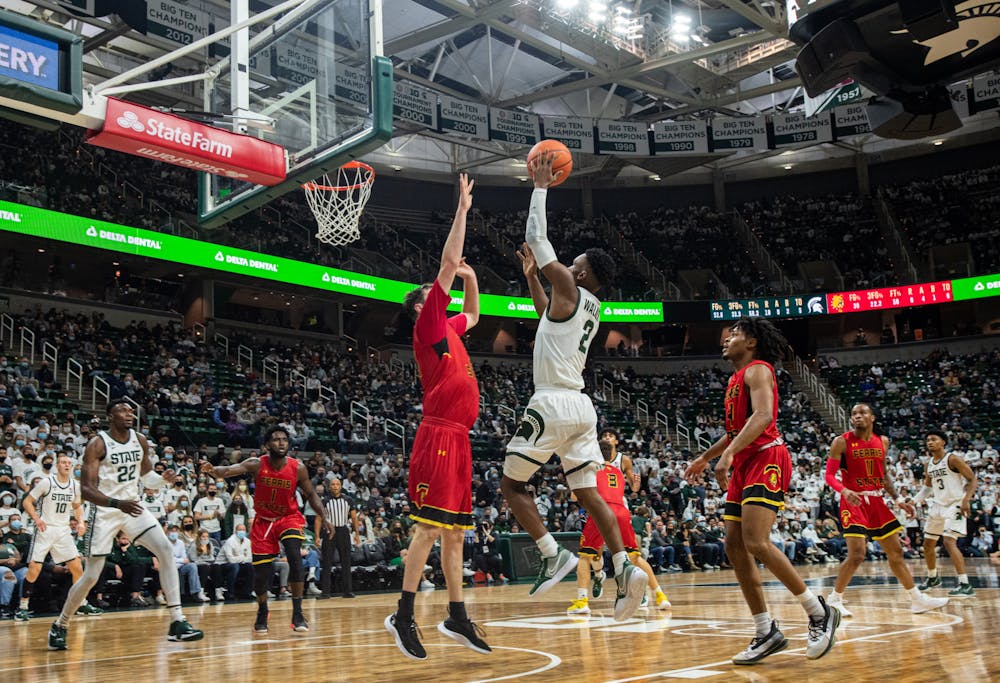 <p>Michigan State junior guard Tyson Walker (2) goes in for a layup during Michigan State&#x27;s victory over Ferris State on Oct. 27, 2021.</p>