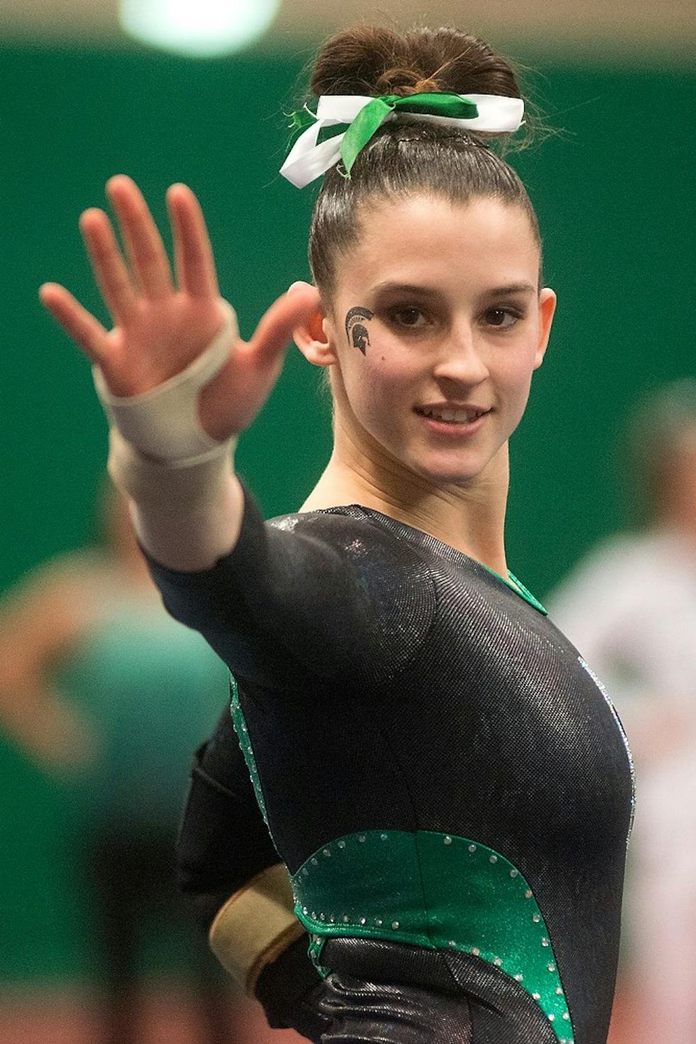 <p>Gymnast Elena Lagoski performs during the floor event March 15, 2014, at Jenison Field House during the Big Ten Quad Meet against Nebraska, Illinois and Ohio State. The gymnastics team finished third with a 196.200, which was a team season-best. Julia Nagy/The State News</p>