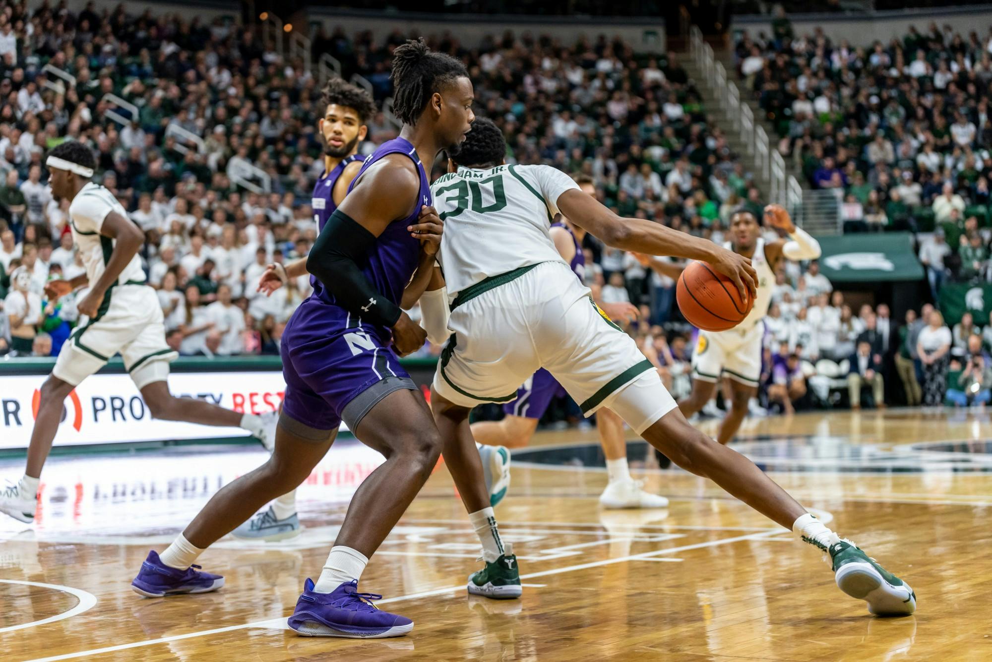 <p>Sophomore forward Marcus Bingham Jr. (30) backs down Northwestern’s Jared Jones (left). The Spartans defeated the Wildcats, 79-50, on Jan. 29, 2020 at the Breslin Student Events Center. </p>