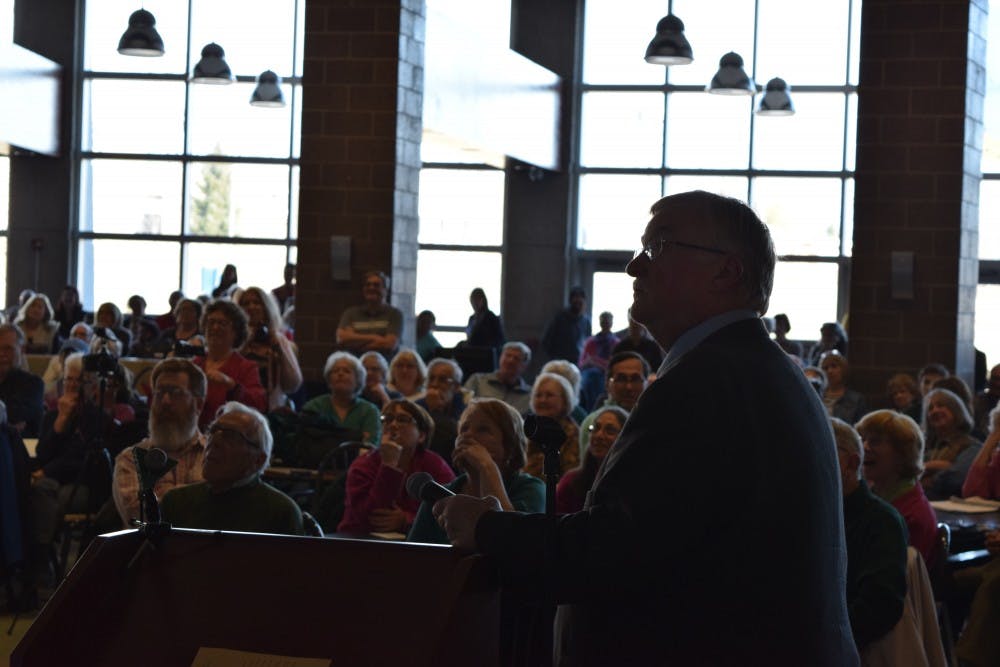 <p>Michigan Election Reform Alliance Redistricting Chair Walt Sorg watches part of his presentation at the&nbsp;<a href="https://www.facebook.com/events/1329892107052309/" target="_blank">End Partisan Gerrymandering In Michigan Forum</a> held at East Lansing High School, Feb. 19. Sorg and the audience were watching an anti-gerrymandering video featuring former California Gov. Arnold Schwarzenegger, which can be viewed&nbsp;<a href="https://www.facebook.com/attn/videos/1285232444845545/" target="_blank">here</a>.</p>