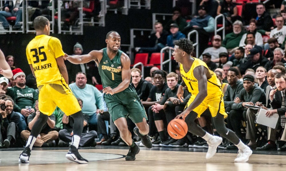 Sophomore guard Joshua Langford (1) runs around a screen during the game against Oakland, on Dec. 16, 2017, at Little Caesar's Arena. The Spartans defeated the Golden Grizzlies, 86-73.