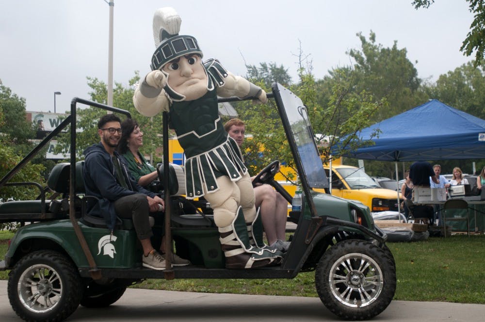 <p>Sparty makes his way around freshman move-in on Aug. 30, 2015, at Brody Complex. Courtney Kendler/The State News</p>