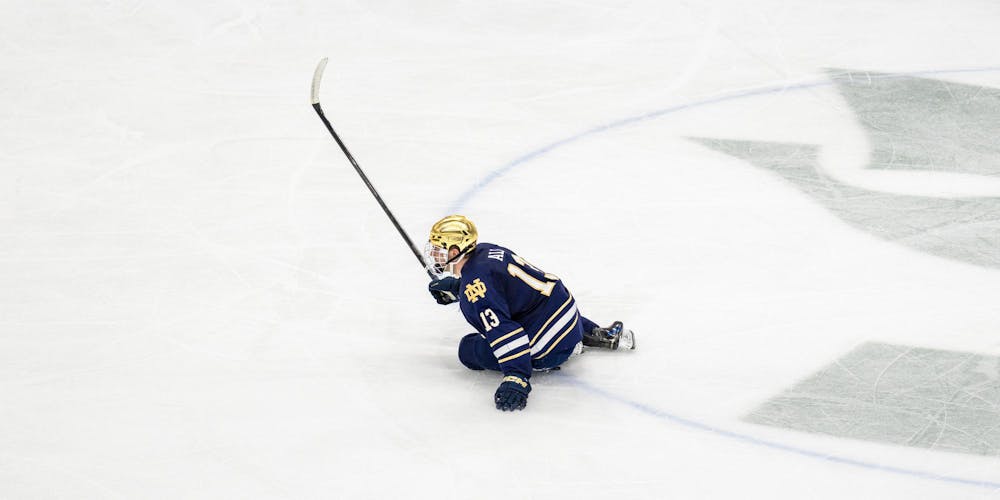 Notre Dame Jr. F, Brennan Ali (13), slips near center ice and watches as MSU scores a goal in Munn Ice Arena in East Lansing, MI on Feb. 19, 2026.