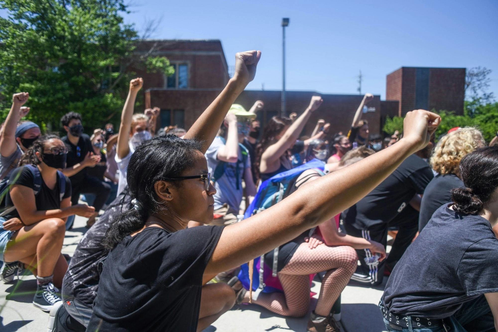 <p>Protesters take a knee outside of the East Lansing Police Department at the “We’re next!” protest against police brutality in East Lansing on June 2, 2020. The protest was peaceful and speakers talked about the current state of the nation as well as removing East Lansing Police Officer Andrew Stephenson from his position.</p>