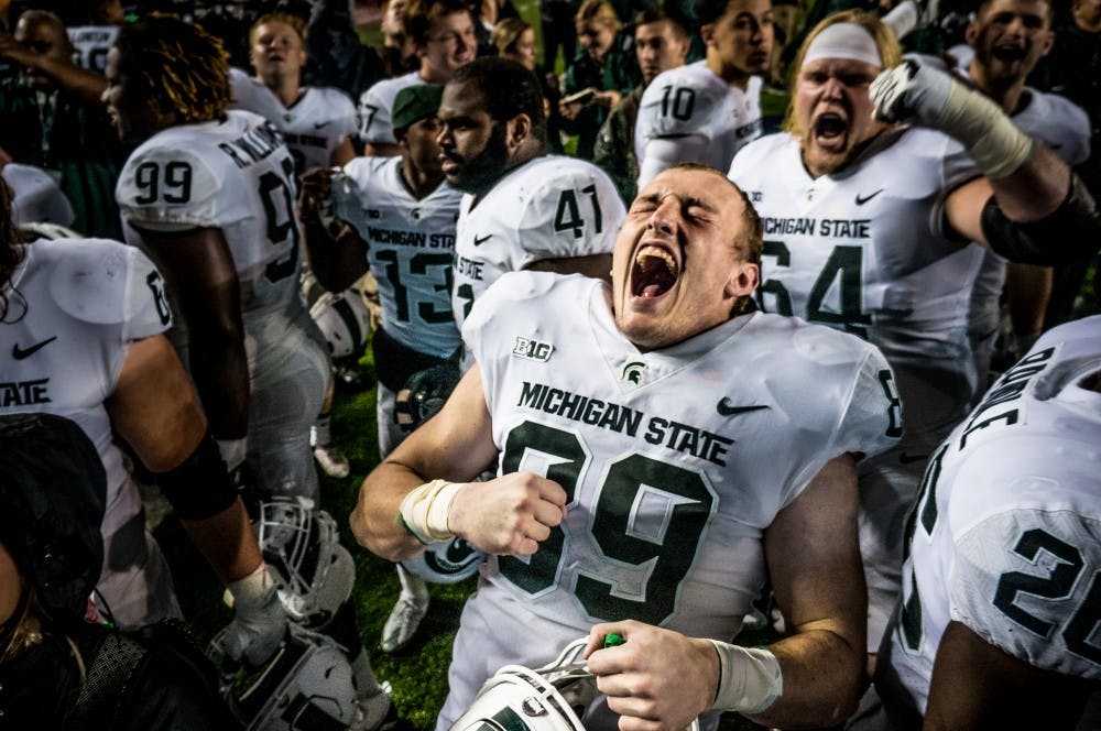 <p>Freshman tight end Matt Dotson (89) celebrates &nbsp;after the game against Michigan on Oct. 7, 2017 at Michigan Stadium. The Spartans defeated the Wolverines, 14-10.</p>