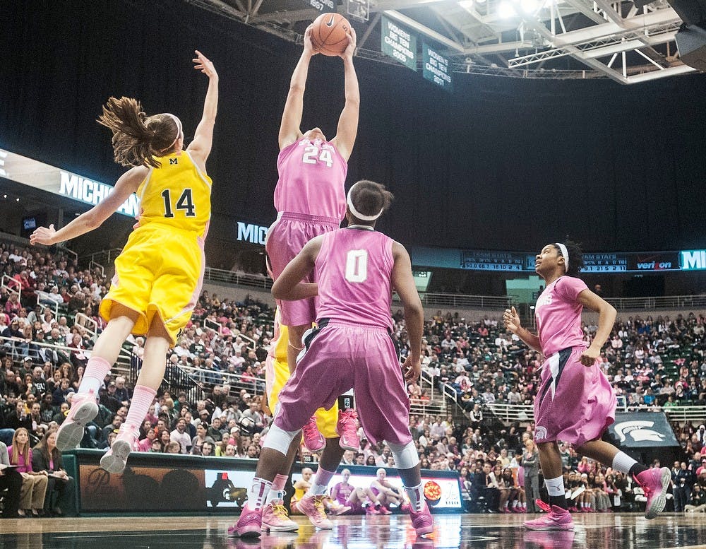 	<p>Senior forward Courtney Schiffauer jumps to grab a rebound over Michigan guard Nicole Elmblad on Monday, Feb. 4, 2013, at Breslin Center. The Spartans defeated the Wolverines, 61&#8212;46, improving their record to 6-3 in the Big Ten. Adam Toolin/The State News</p>