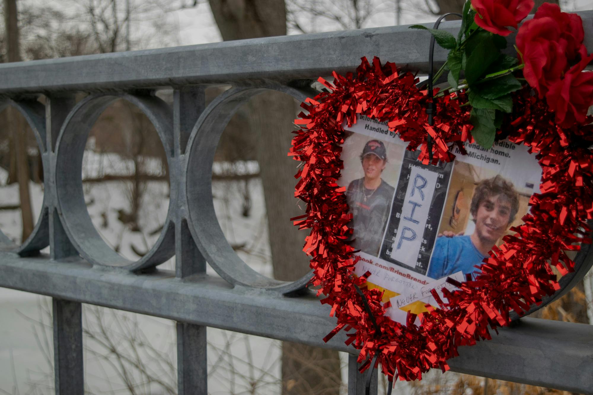 <p>A heart hung on the Beal st bridge to commemorate the death of Grand Valley student Brendan Santo. Shot on Feb. 10, 2022</p>
