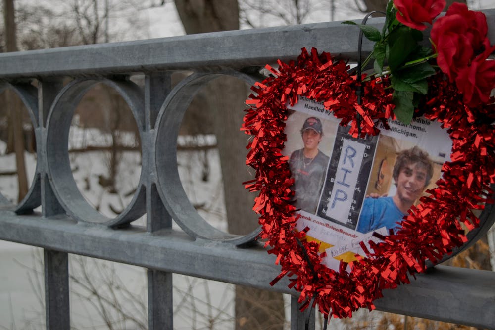 <p>A heart hung on the Beal st bridge to commemorate the death of Grand Valley student Brendan Santo. Shot on Feb. 10, 2022</p>