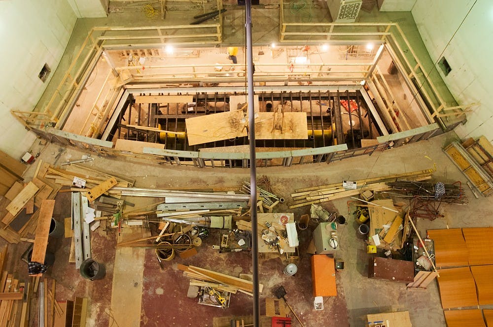 	<p>An overhead view of construction on the stage area in Fairchild Theatre. Renovations will be made to the main theater, pictured, along with the black box, restrooms and elevator. Khoa Nguyen/ The State News</p>