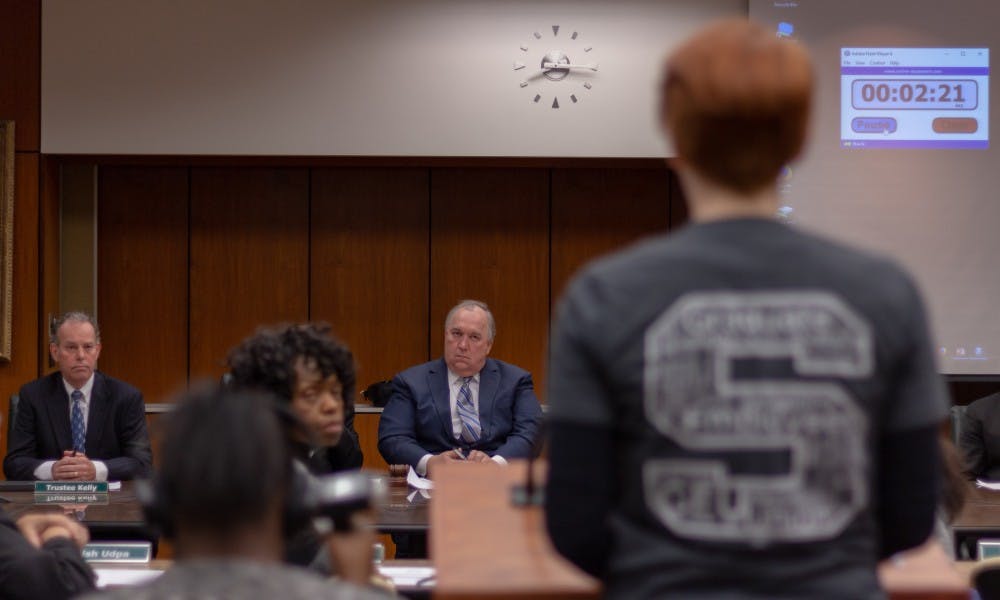 <p>Interim President John Engler listens to MSU Student Shawna Rowe as she shares another student&#x27;s sexual assault story.</p>