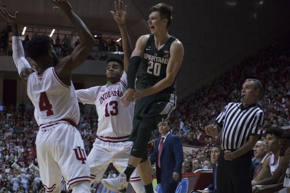 Junior guard Matt McQuaid (20) makes a jump pass during the game against Indiana on Feb. 3, 2018 at Simon Skjodt Assembly Hall. The Spartans lead the Hoosiers 32-24 at half. (C.J. Weiss | The State News) 