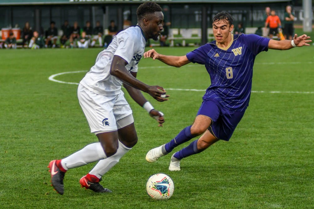 <p>Senior defender Michael Wetungu (17) fights for the ball against Washington’s forward Gio Miglietti (8) during the game against Washington on Sept. 6, 2019. The Spartans fell to the Huskies, 0-1.</p>