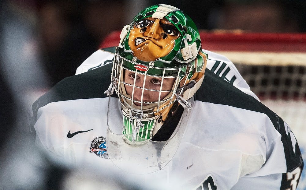 	<p>Freshman goaltender Jake Hildebrand awaits a face-off in the Spartans&#8217; defensive zone Sunday, Dec. 30, 2012, at Joe Louis Arena in Detroit. The Wolverines defeated the Spartans 5-2 during the Great Lakes Invitational third place game. Adam Toolin/The State News</p>