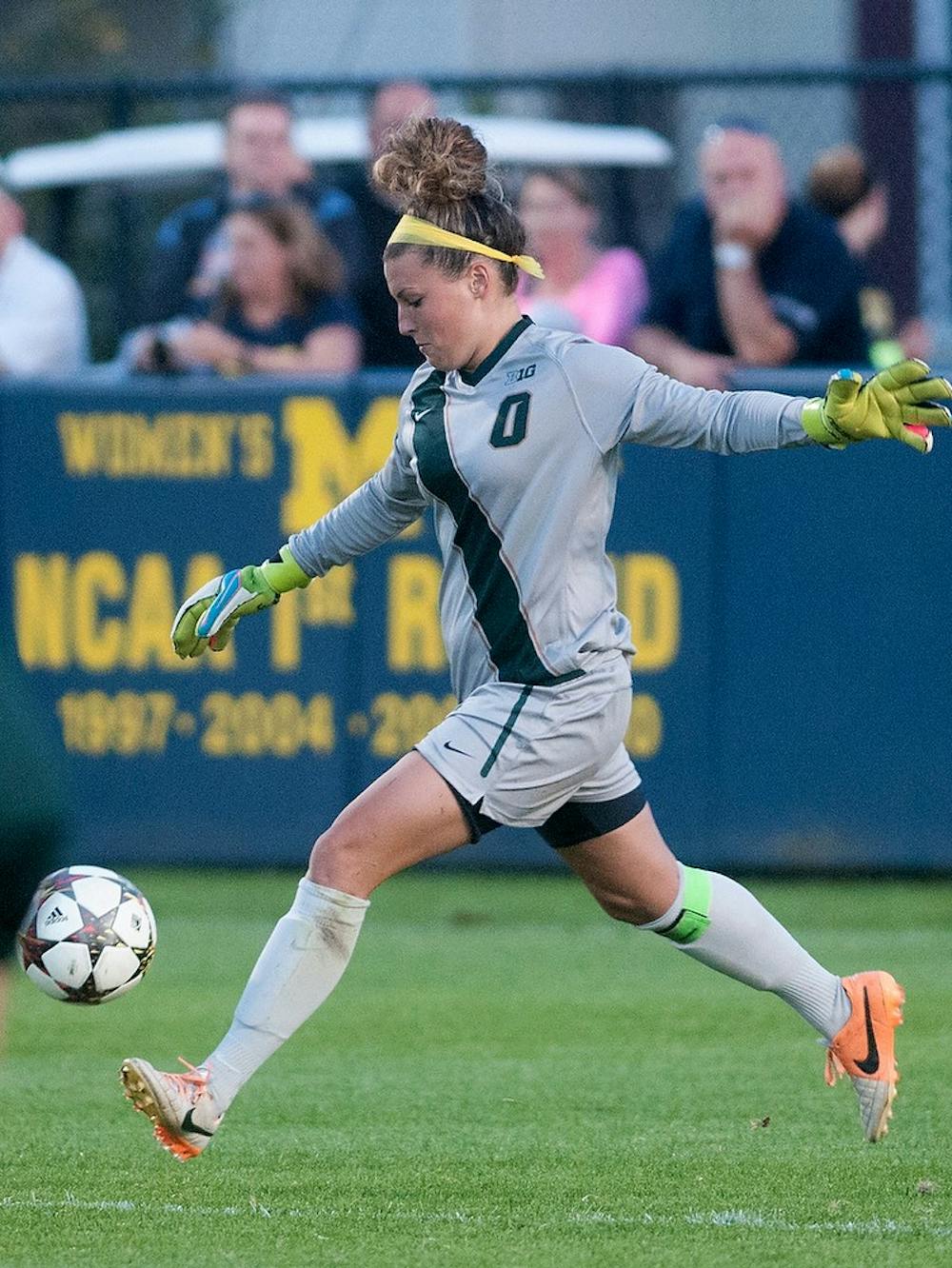 <p>Senior goalie Courtney Clem kicks the ball during the game against Michigan on Sept. 27, 2014, at the U-M Soccer Stadium in Ann Arbor, Mich. The Wolverines defeated the Spartans, 2-1. Jessalyn Tamez/The State News. </p>
