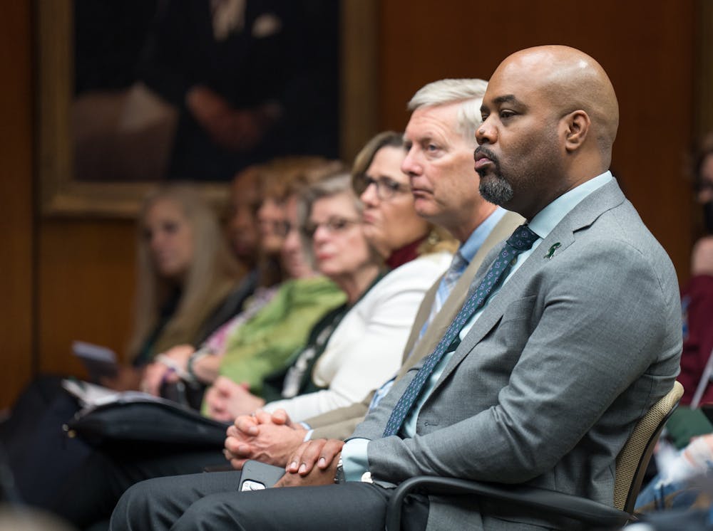 The Michigan State University Board of Trustees met in the Hannah Administration Building on April 22, 2022. The audience watched as members of the swim and dive team spoke out during public comment.