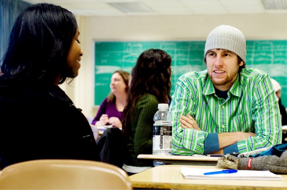 Second year clinical social work graduate students Eric VanBuskirk and Sierra Gardner discuss emotion Tuesday in their SOC 851 class. Nationally, between fall or 2008 and fall of 2009 the number of graduate school applications increased 8.3%. Matt Hallowell/The State News