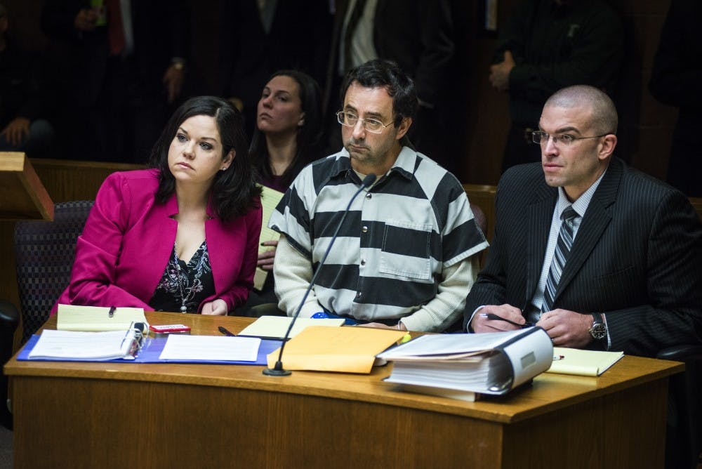 From left to right, defense attorney Shannon Smith, former MSU employee Larry Nassar and defense attorney Matthew Newbury listen to 55th District Court Judge Donald L. Allen Jr. speak before a pretrial hearing begins on Feb. 17, 2017 at 55th District Court in Mason, Mich. The hearing occurred as a result of former MSU employee Larry Nassar's alleged sexual abuse.