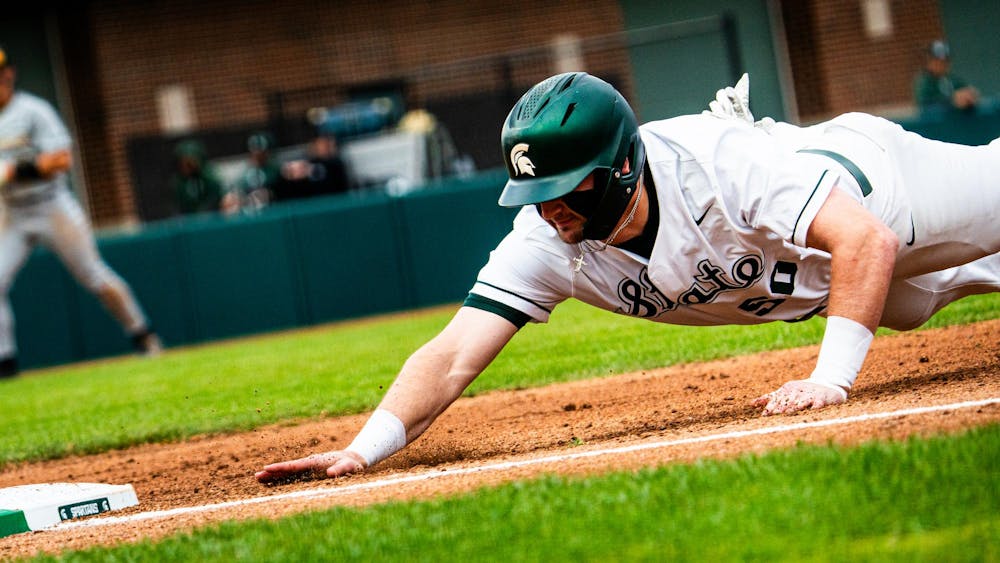 MSU senior outfielder Will Shannon (50) dives back to first base during a game at McLane Stadium on April 13, 2025.