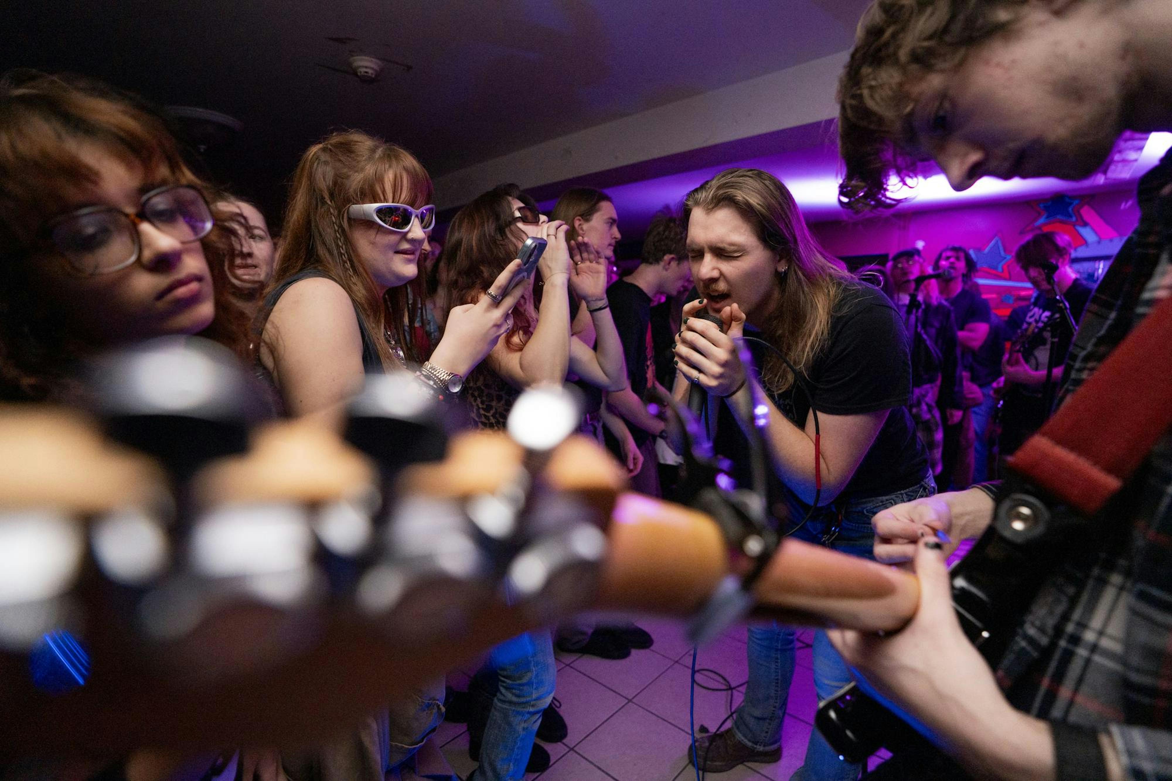 <p>Faceless singer and forestry junior Cooper Randall performs for a full house at Phoenix House Cooperative in East Lansing, Michigan during their Valentine's Day party on Feb. 15, 2025.</p>