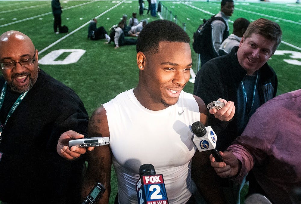 Junior running back Le'Veon Bell laughs during an interview with reporters March 13, 2013, during Pro Day at the Duffy Daugherty Football Building. MSU football holds the annual event for NFL scouts and coaches to get a closer look at the Spartans' NFL prospects. Adam Toolin/The State News