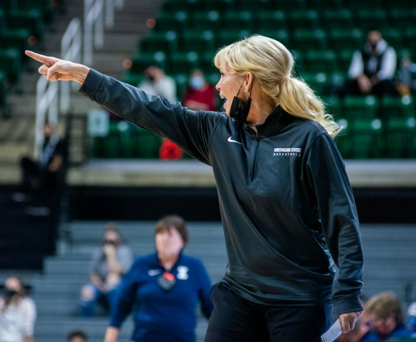 <p>Coach Suzy Merchant yells at the team during the third quarter. The Spartans beat the Fighting Illini, 75-60, in their Big Ten opener on Dec. 9, 2021. </p>