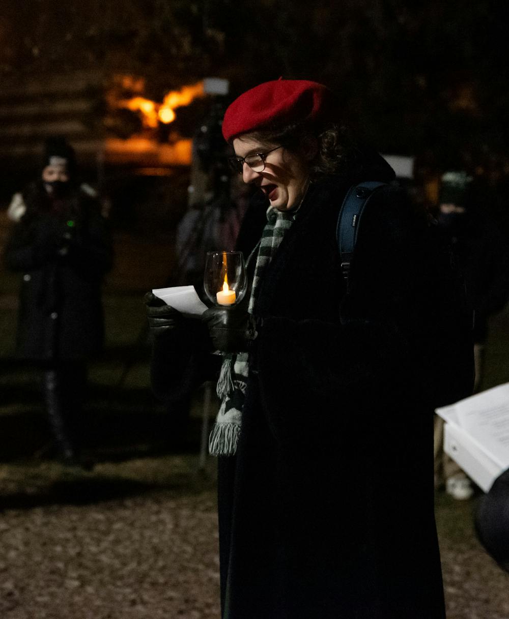 <p>Maddie Tocco gives a speech at the rock at the candelight vigil for the Oxford community on Dec. 7, 2021.</p>