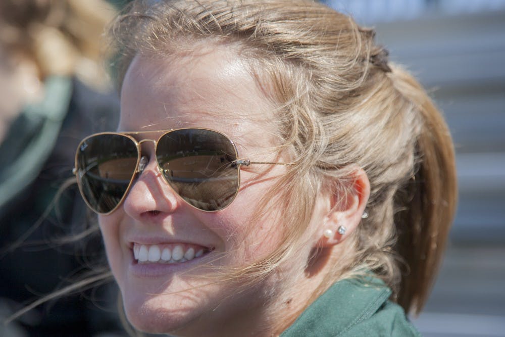 Junior marketing major Sophie Potter watches the game against Central Michigan on April 25, 2018. The Spartans defeated the Chippewas, 8-1. 