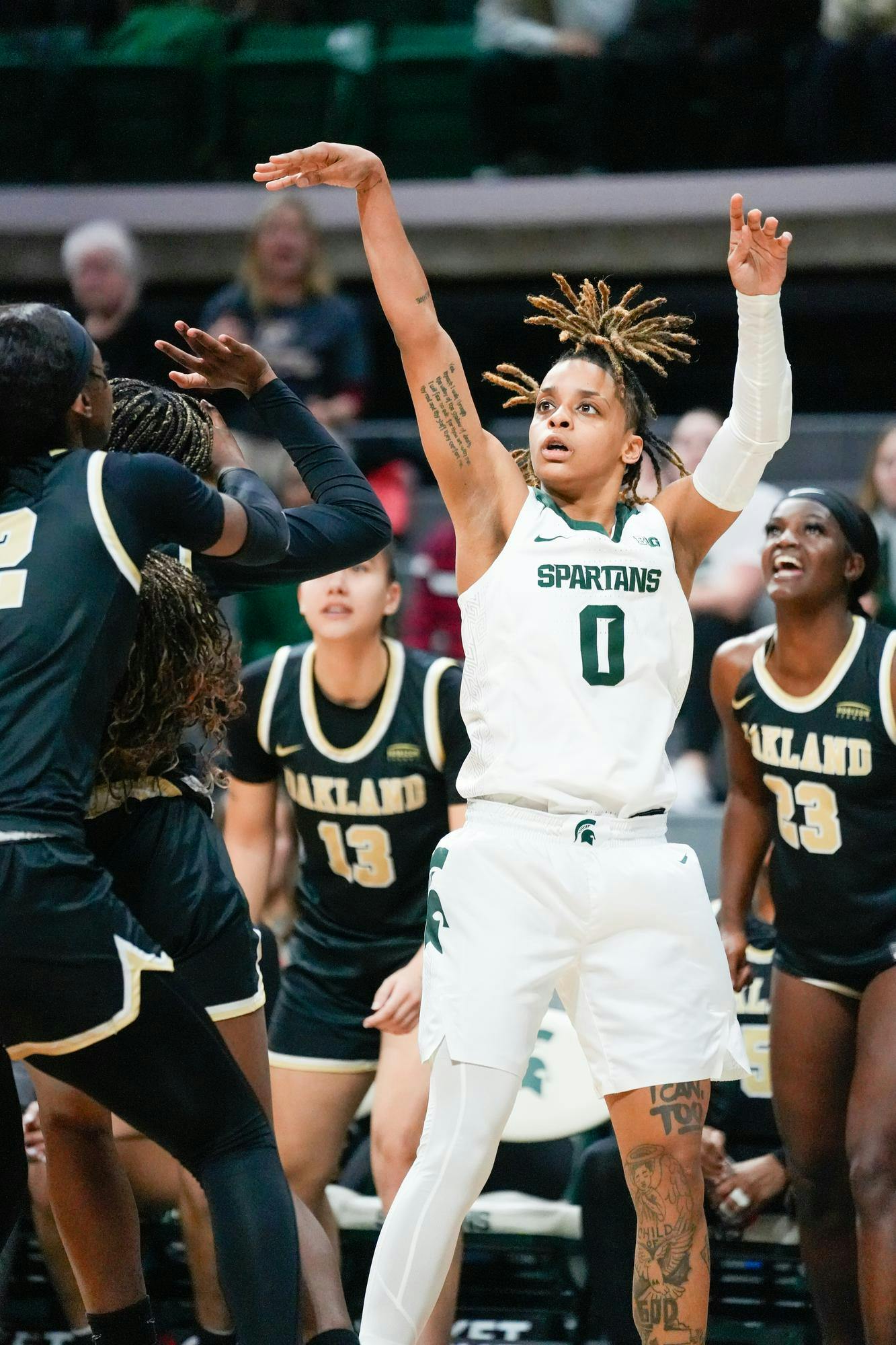 <p>Junior, DeeDee Hagemann shoots a three during the matchup against Oakland University at the Breslin Center on Nov. 8, 2023.</p>