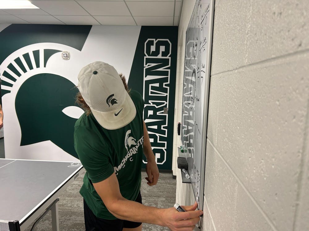 <p>MSU hockey junior Joey Larson updates the team's running scoreboard for its pingpong contests on Nov. 1, 2024. Junior Karsen Dorwart said some members of the team play for about an hour every day.</p>