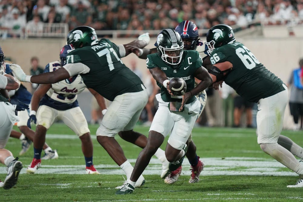 <p>Michigan State quarterback Aidan Chiles (2) hands off the ball on Aug. 30, 2024</p>