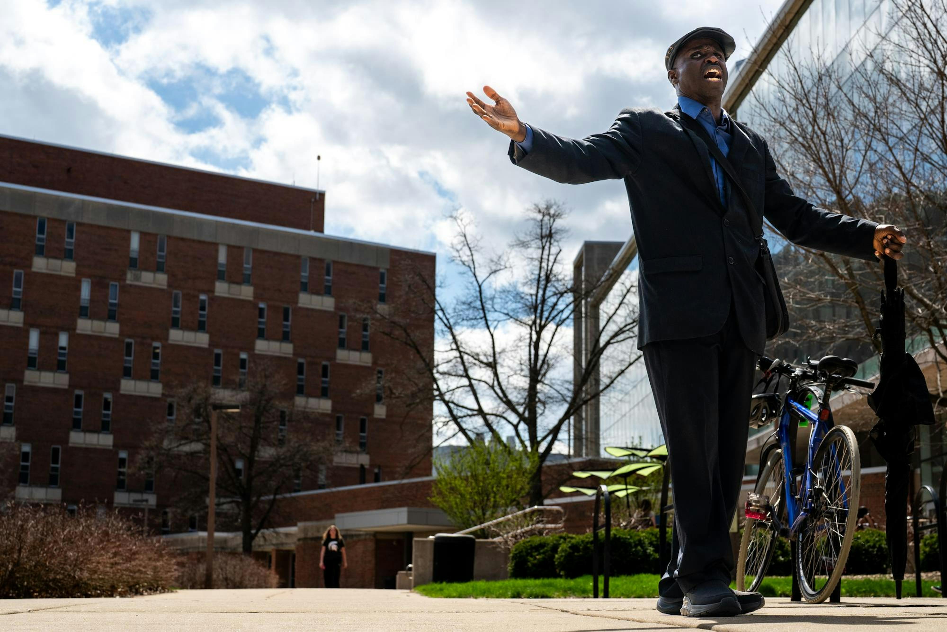 <p>Pastor Michael Venyah delivers a sermon outside Wells Hall in People’s Park on Michigan State University’s campus in East Lansing, Mich., on Monday, April 13, 2026.</p>