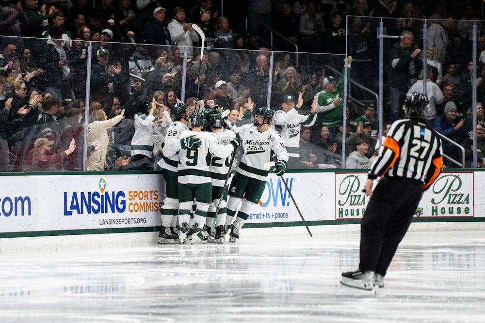 The Michigan State hockey team celebrates after scoring a point against Notre Dame at Munn Ice Arena in East Lansing, Michigan, on Friday, Feb. 20, 2026