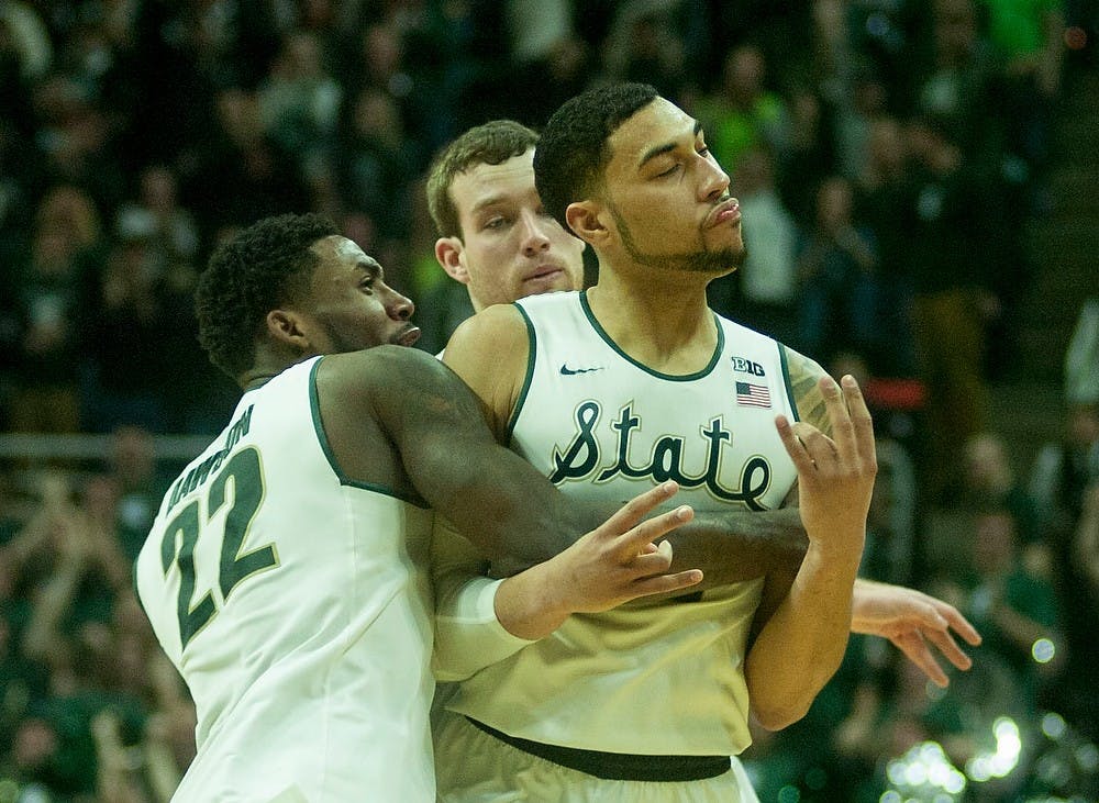 <p>Junior guard Denzel Valentine celebrates his game winning 3-pointer Feb. 14, 2015, during the game against Ohio State at Breslin Center. The Spartans defeated the Buckeyes, 59-56. Erin Hampton/The State News</p>