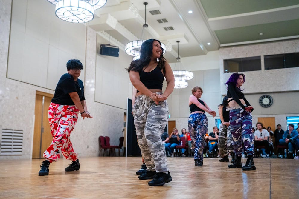 Dancers smile at the crowd while performing during CTRL+A’s annual spring showcase at the MSU Union on April 14, 2024.