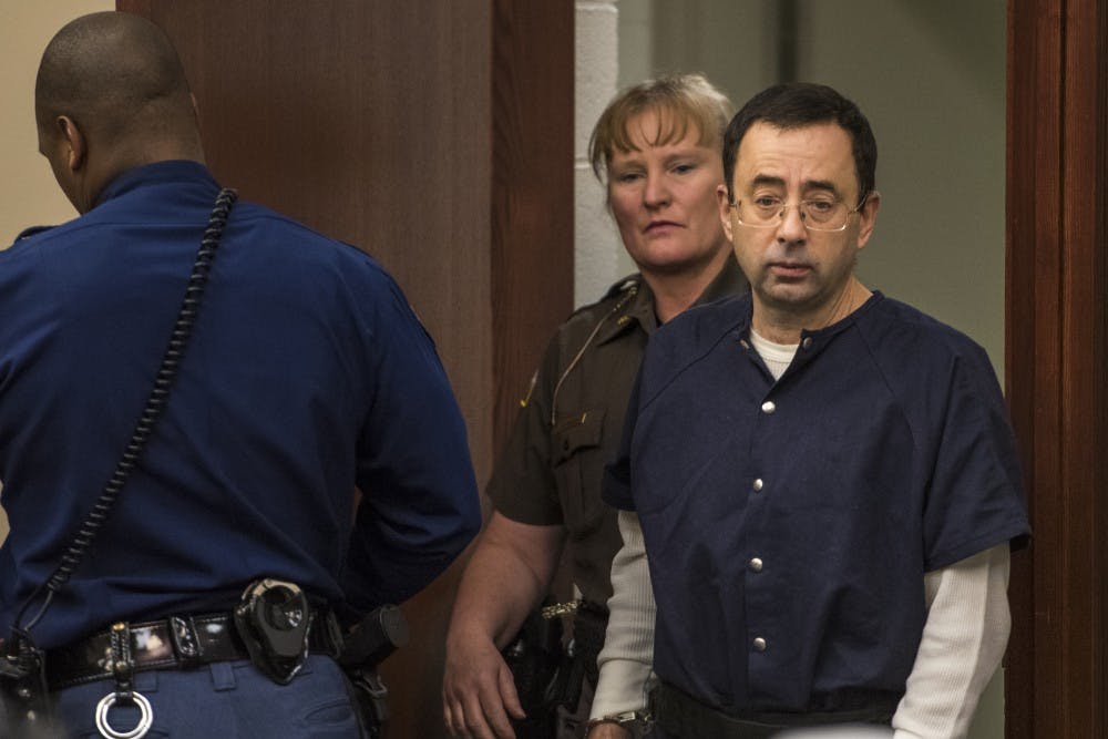 Ex-MSU and USA Gymnastics Dr. Larry Nassar makes his appearance on the fourth day of his sentencing on Jan. 19, 2018 at the Ingham County Circuit Court in Lansing. (Nic Antaya | The State News)