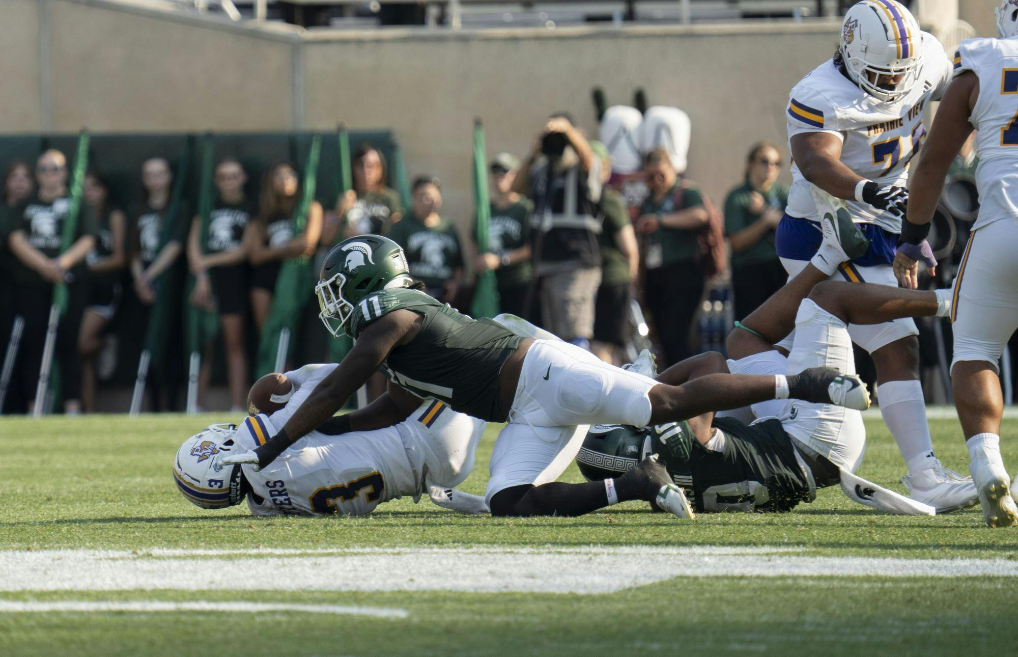 <p>MSU sophomore defensive line Ken Talley (11) tackles Prairie View junior quarterback Cameron Peters (3) during the MSU vs Prairie View football game on Sept. 14, 2024.</p>